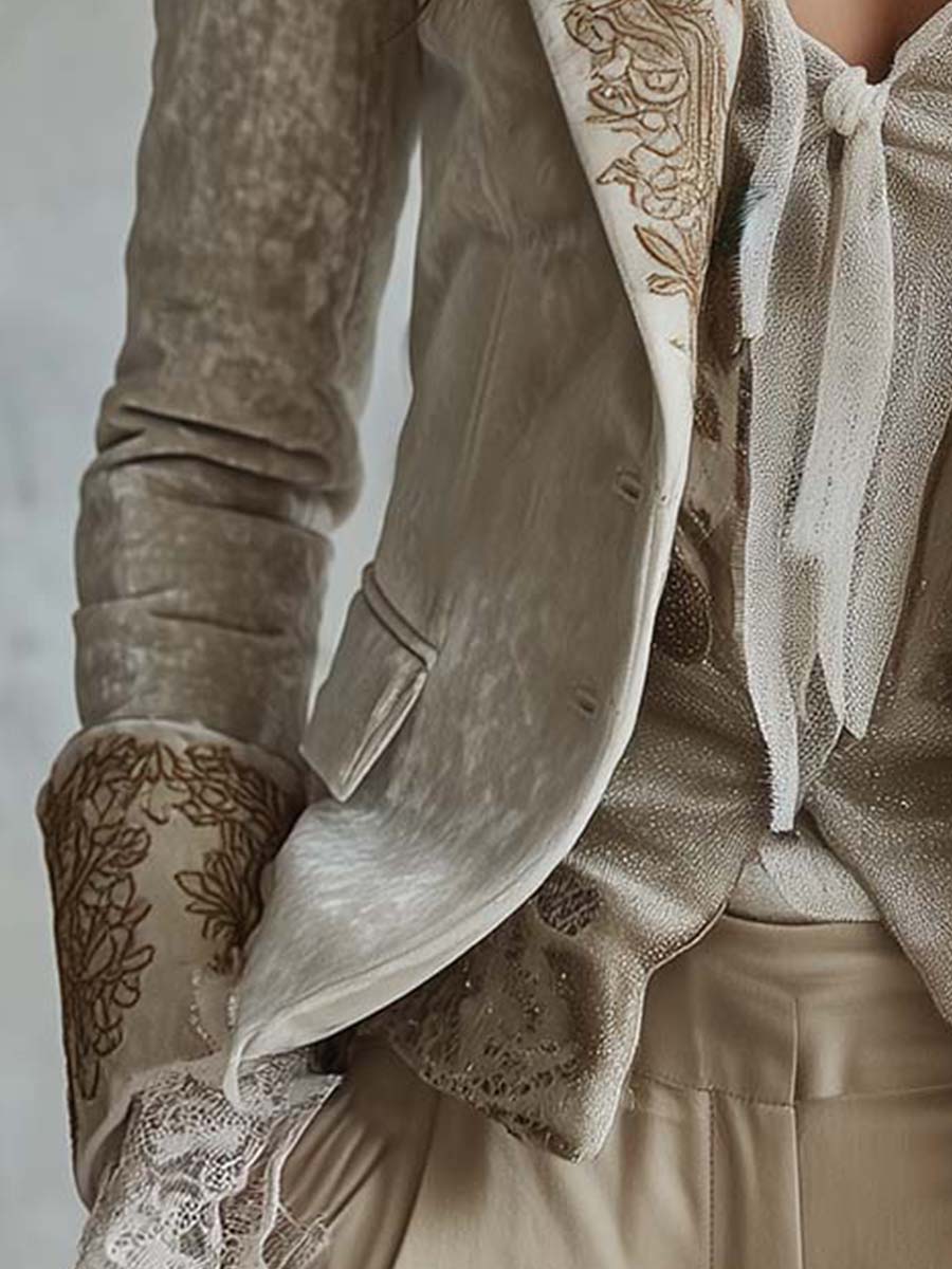 Ivory tailored blazer with gold-toned floral embroidery on the lapels and cuffs