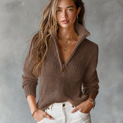 Woman wearing a loose-fit half-zip collar long-sleeve knit sweater