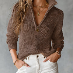 Woman wearing a loose-fit half-zip collar long-sleeve knit sweater
