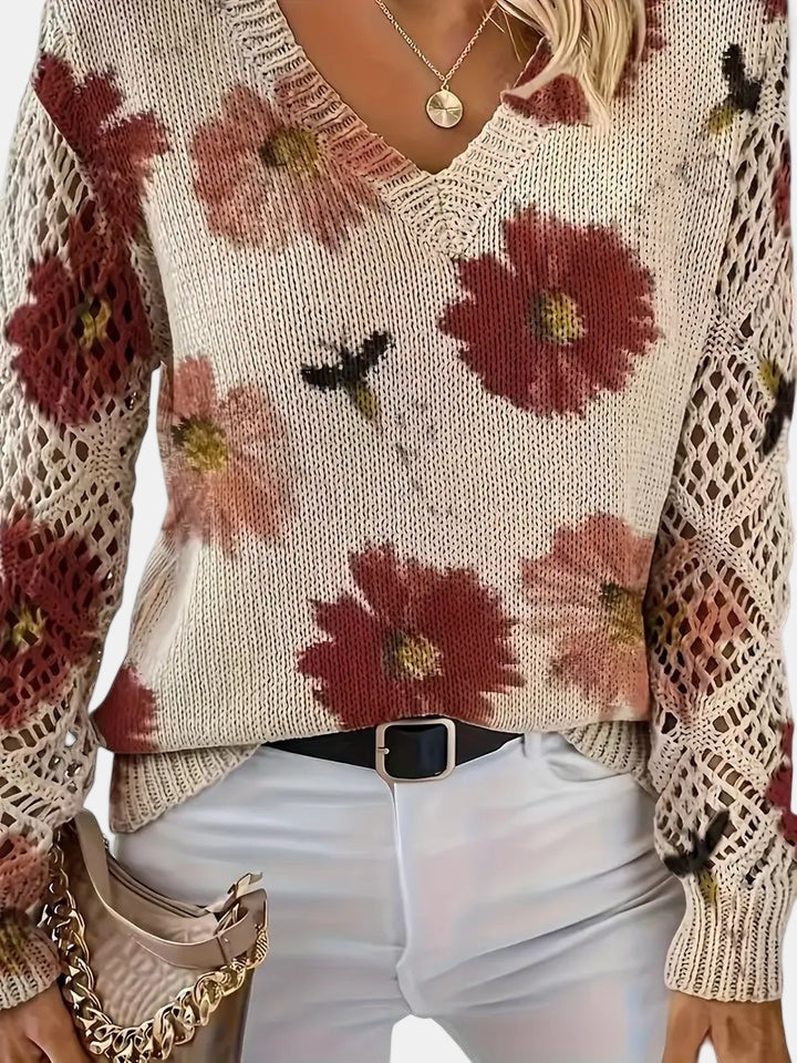 Women's floral knit V-neck sweater with open-knit sleeves and ribbed cuffs and hem