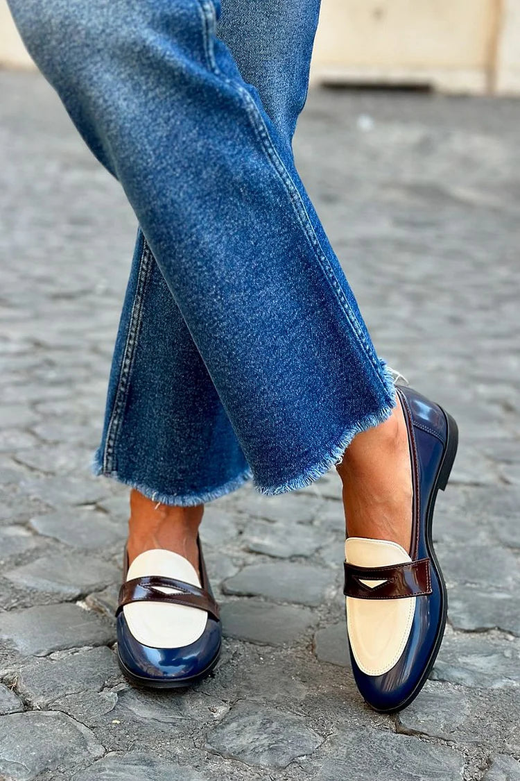 Navy blue two-tone loafer with contrast panels and a classic slip-on shape