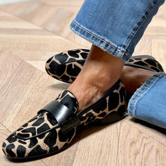 Animal print slip-on loafer with black strap detailing
