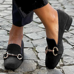 Black suede-look loafers with a gold-toned horsebit detail and slip-on style