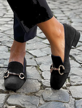Black suede-look loafers with a gold-toned horsebit detail and slip-on style