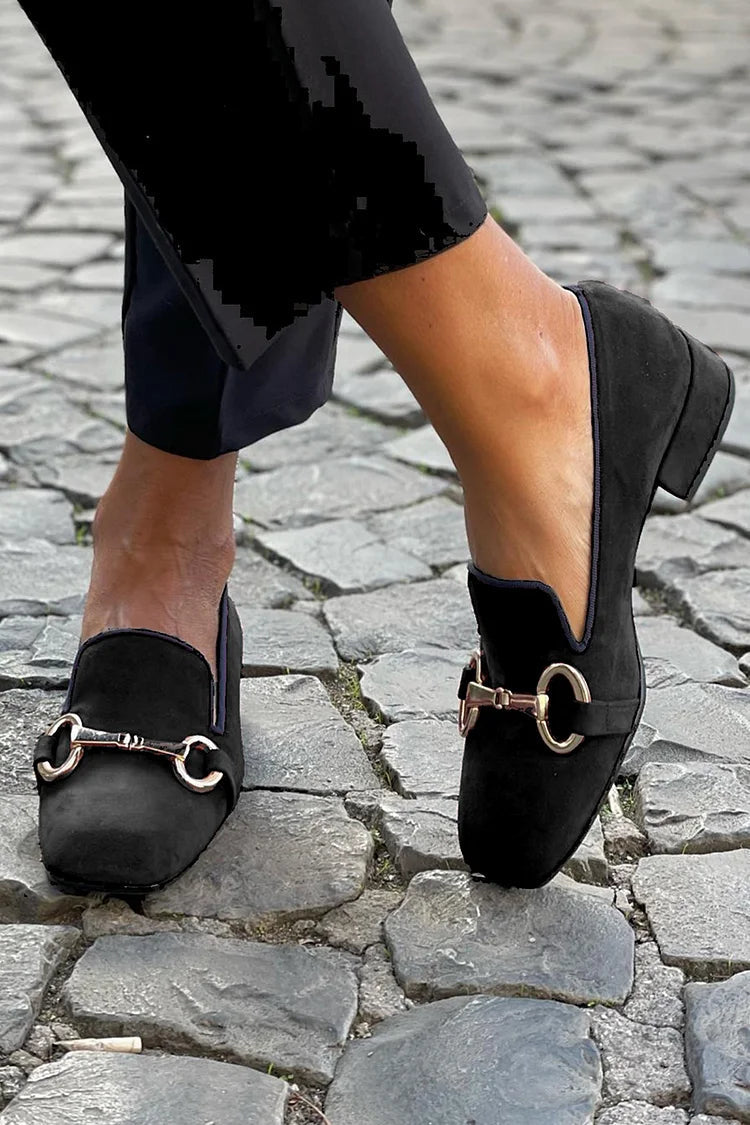 Black suede-look loafers with a gold-toned horsebit detail and slip-on style