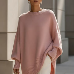 Oversized poncho-style sweater with round neckline, ribbed cuffs and hem in a neutral tone