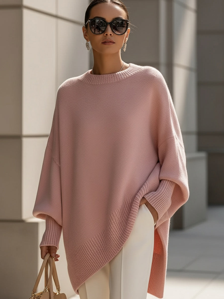 Oversized poncho-style sweater with round neckline, ribbed cuffs and hem in a neutral tone