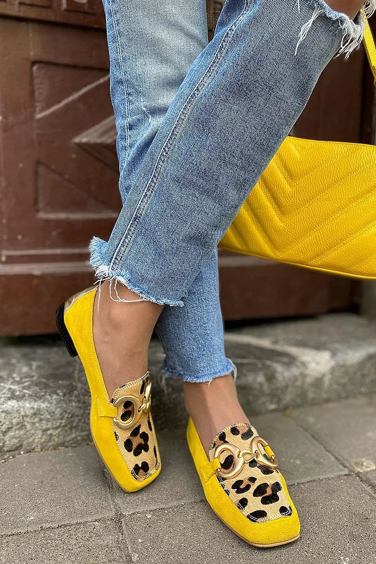 Yellow slip-on loafer with animal print tip and golden ring detail