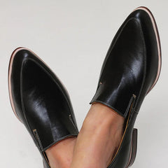 Black minimalist loafers with clean lines and a modern silhouette