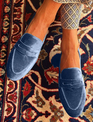 Blue velvet slip-on loafer with minimal design and clean lines