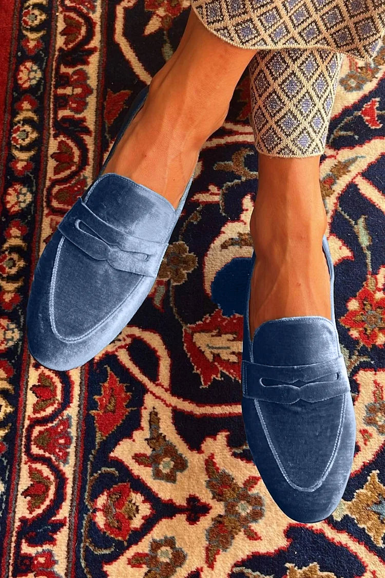 Blue velvet slip-on loafer with minimal design and clean lines