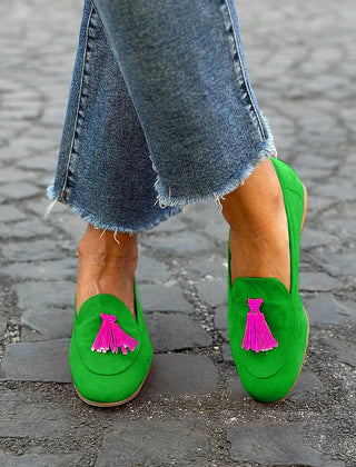 Bright green slip-on loafer with fuchsia tassel detail