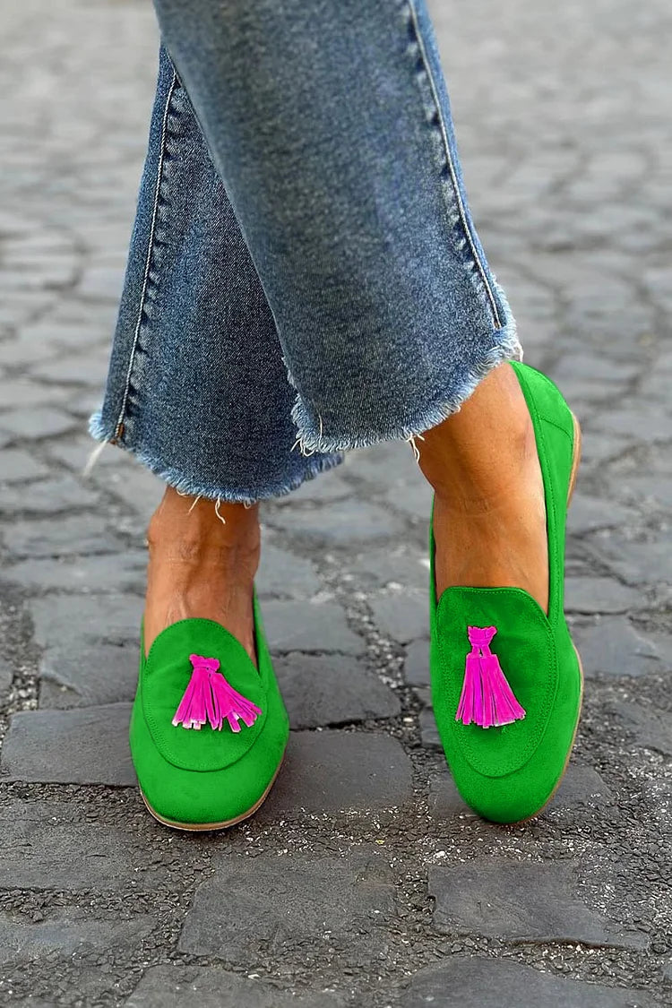 Bright green slip-on loafer with fuchsia tassel detail