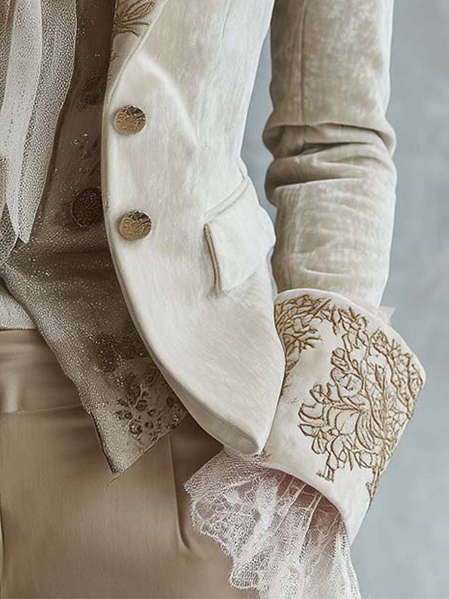 Ivory tailored blazer with gold-toned floral embroidery on the lapels and cuffs