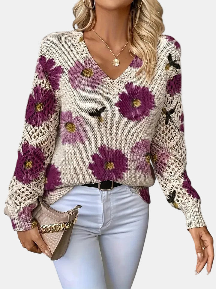 Women's floral knit V-neck sweater with open-knit sleeves and ribbed cuffs and hem