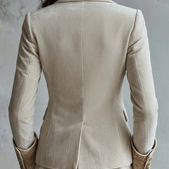 Ivory tailored blazer with gold-toned floral embroidery on the lapels and cuffs
