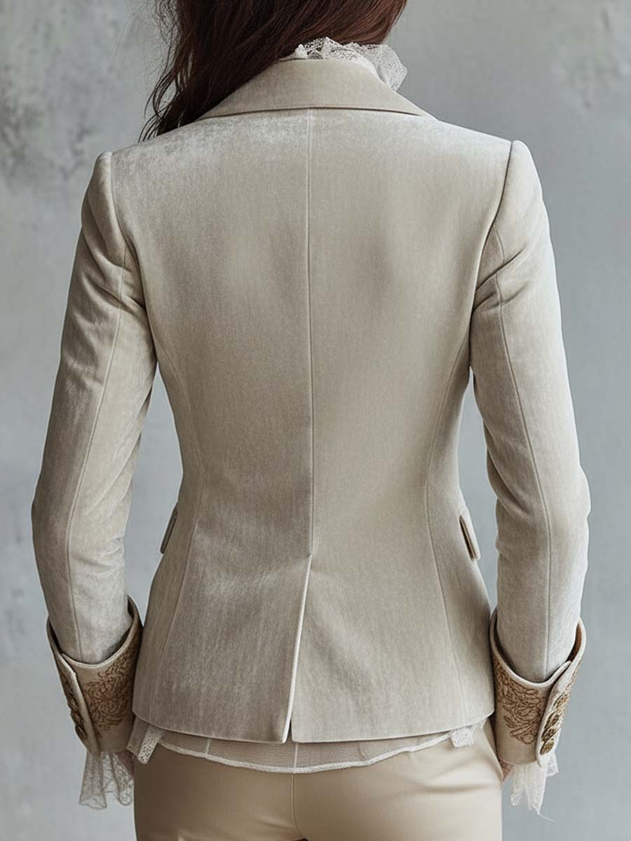 Ivory tailored blazer with gold-toned floral embroidery on the lapels and cuffs