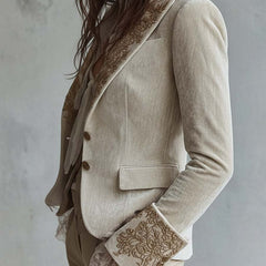 Ivory tailored blazer with gold-toned floral embroidery on the lapels and cuffs