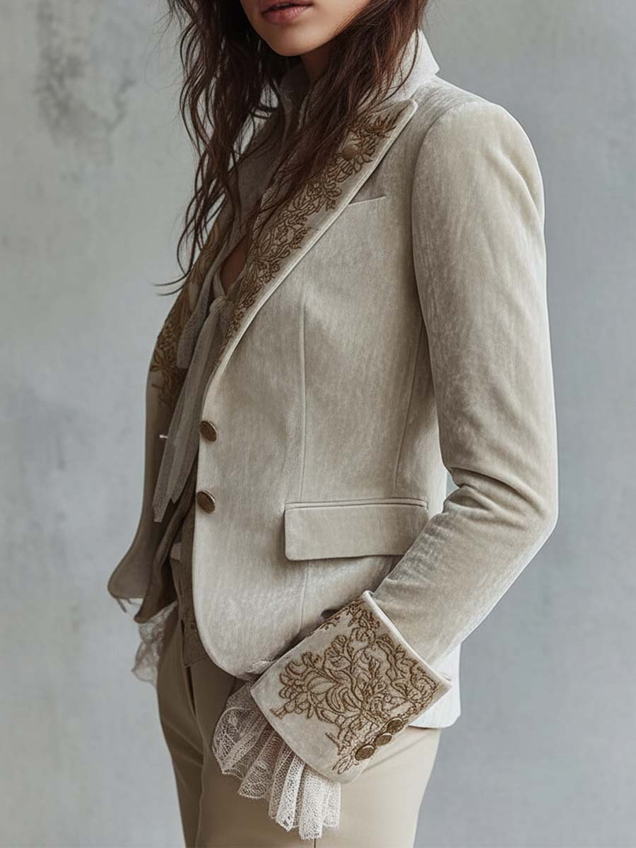 Ivory tailored blazer with gold-toned floral embroidery on the lapels and cuffs