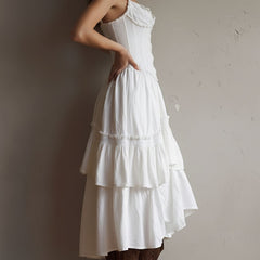 Boho corset midi dress with tiered skirt and delicate lace trim at the neckline