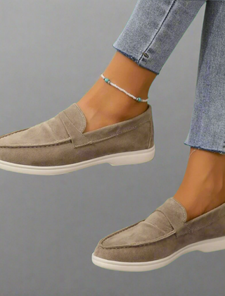 Classic slip-on loafers with smooth finish and streamlined silhouette