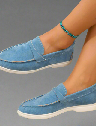 Classic slip-on loafers with smooth finish and streamlined silhouette