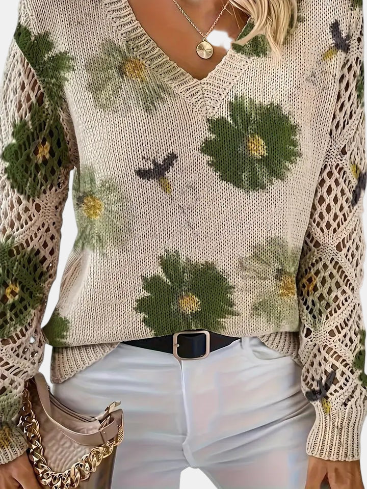 Women's floral knit V-neck sweater with open-knit sleeves and ribbed cuffs and hem