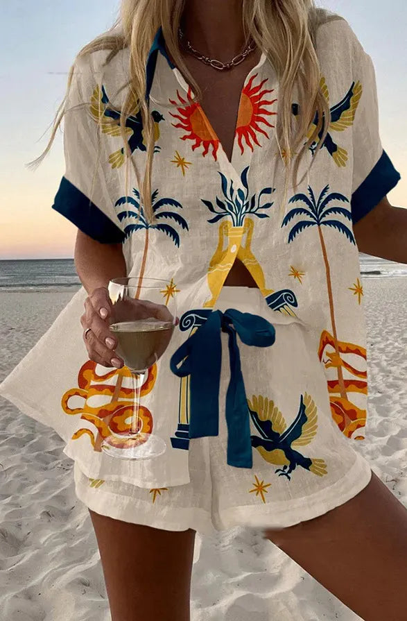 Coordinated summer set with celestial print, navy cuffs and gold accents on a white base