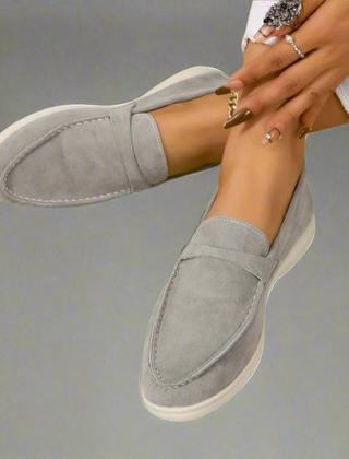 Classic slip-on loafers with smooth finish and streamlined silhouette