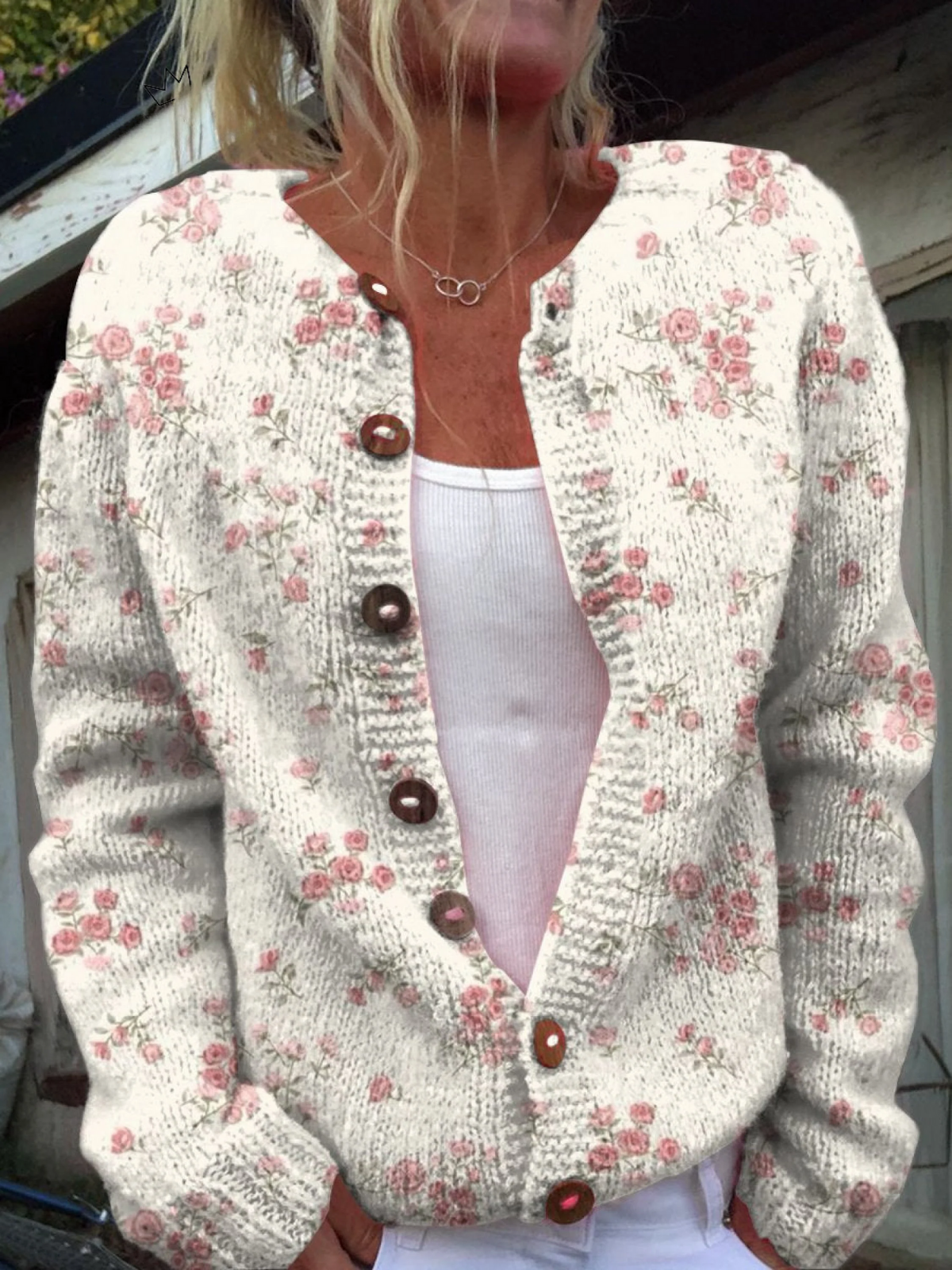 Cream floral knit cardigan with pink roses and dark tortoiseshell-look buttons