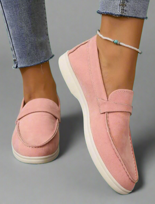 Classic slip-on loafers with smooth finish and streamlined silhouette