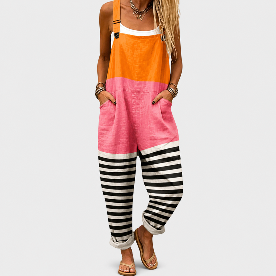 Woman wearing printed wide-leg overalls with adjustable straps in orange, pink or black