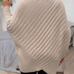 Oversized V-neck sweater with batwing sleeves and asymmetrical wrap hem in khaki and black