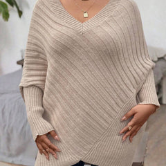 Oversized V-neck sweater with batwing sleeves and asymmetrical wrap hem in khaki and black