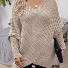 Oversized V-neck sweater with batwing sleeves and asymmetrical wrap hem in khaki and black