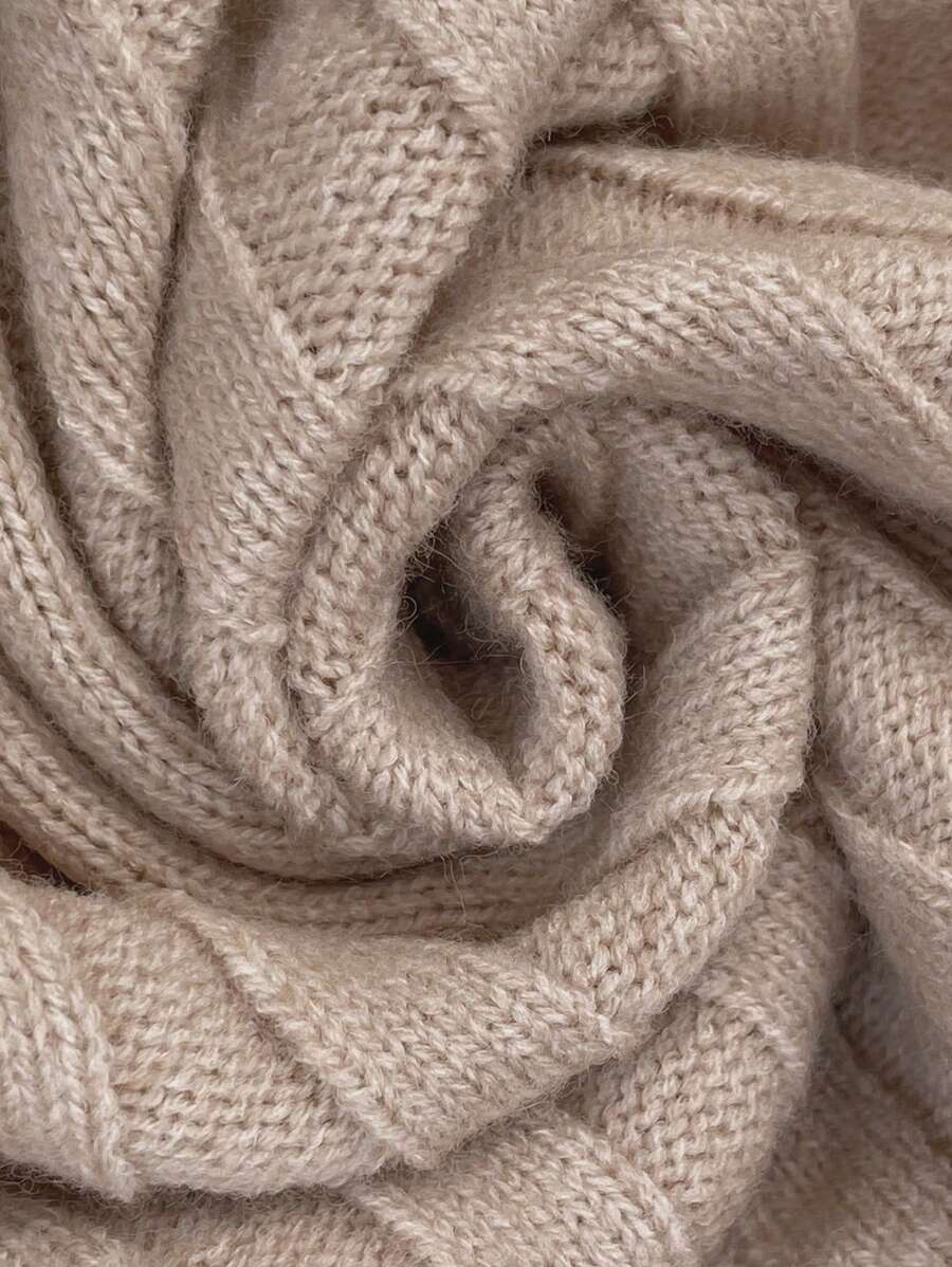 Oversized V-neck sweater with batwing sleeves and asymmetrical wrap hem in khaki and black