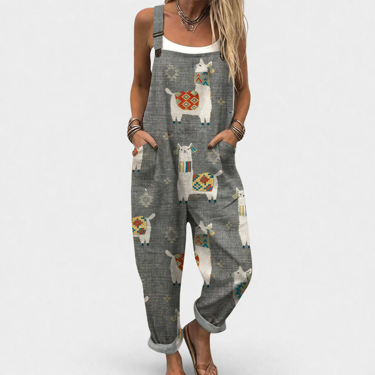Woman wearing printed wide-leg overalls with adjustable straps and a loose, flattering fit