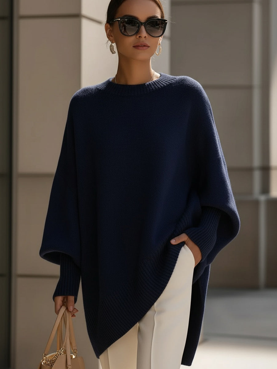 Oversized draped sweater with wide rounded neckline, ribbed cuffs and asymmetrical hem