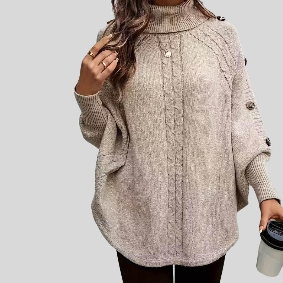 High-neck cable-knit sweater with ribbed turtleneck, shoulder buttons and relaxed oversized fit