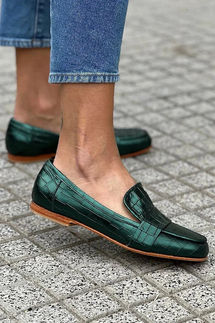 Green croc-effect tapered loafers with a glossy finish, styled for everyday wear