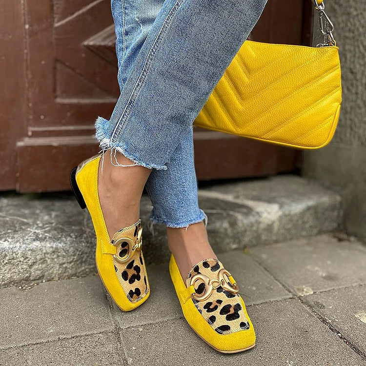 Yellow slip-on loafer with animal print tip and golden ring detail