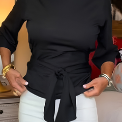 Woman wearing a tie waist flattering top with an adjustable soft waist tie