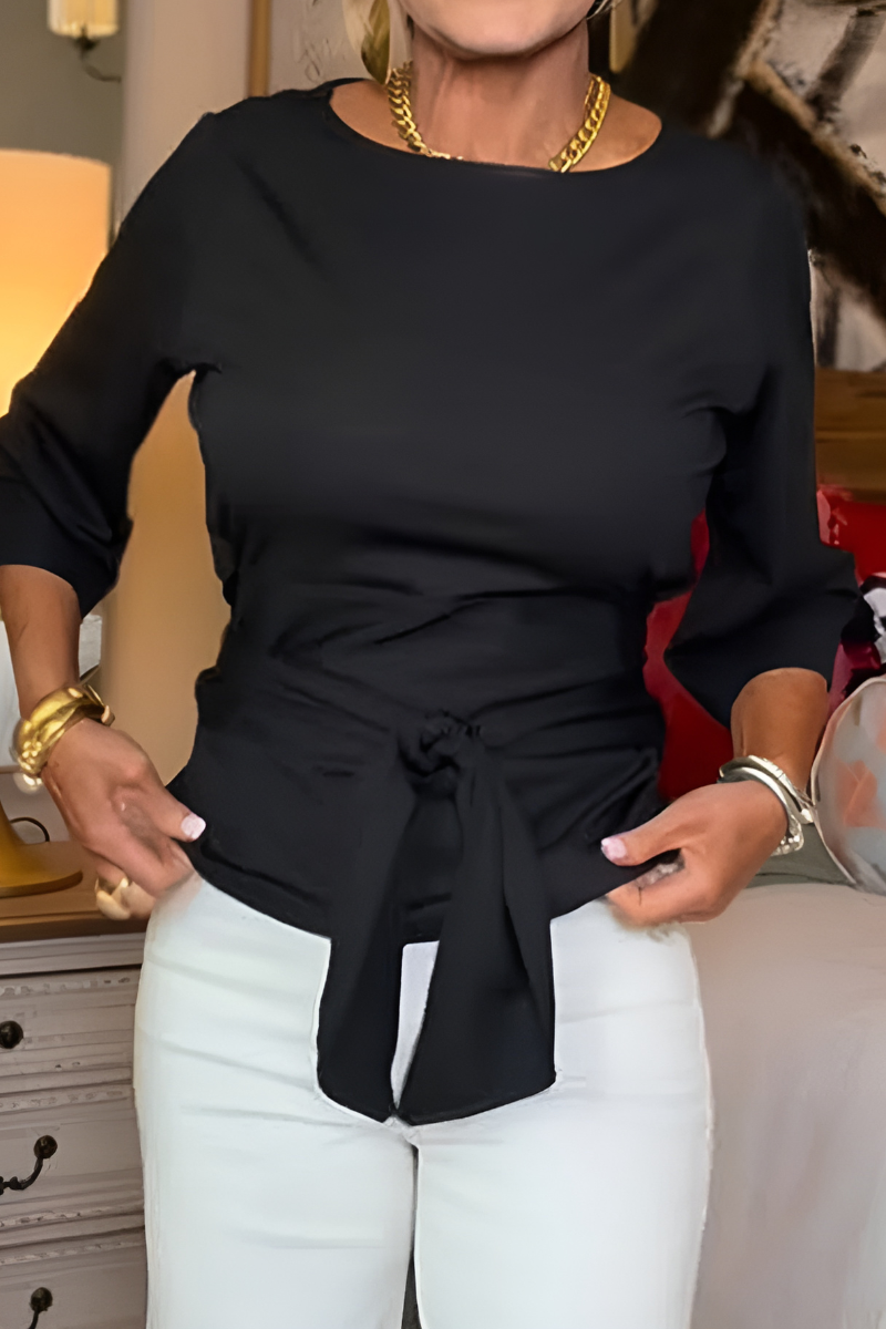 Woman wearing a tie waist flattering top with an adjustable soft waist tie