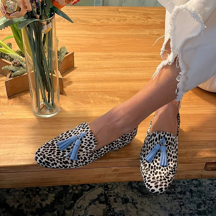 Khaki spotted animal print loafers with blue tassel detail