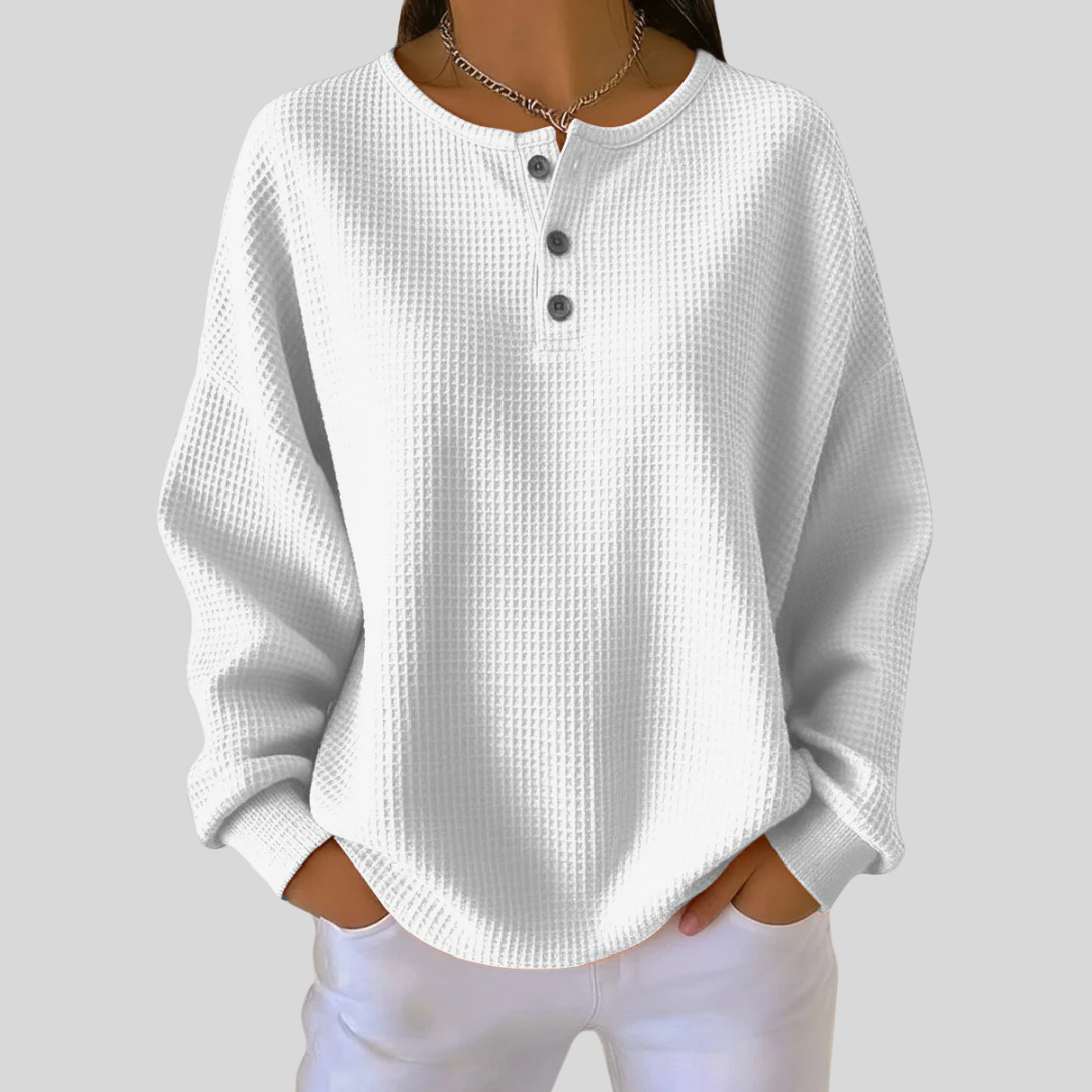 Relaxed-fit waffle-knit henley sweatshirt with button neckline, shown in several colours