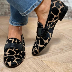 Animal print slip-on loafer with black strap detailing