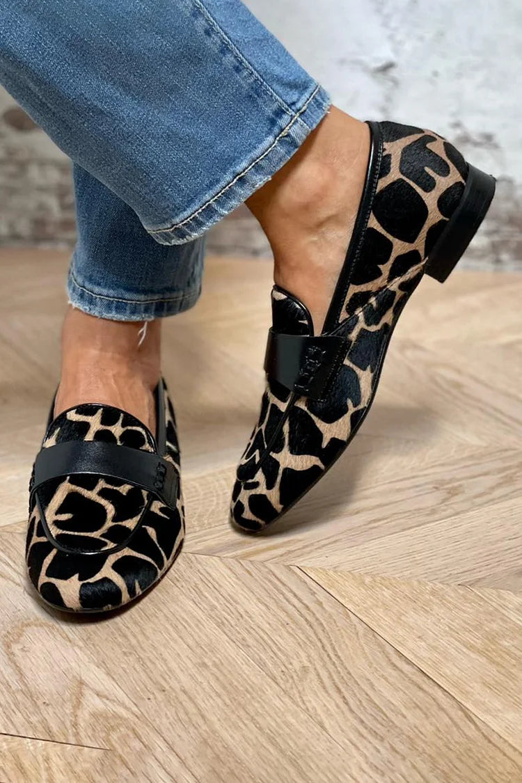 Animal print slip-on loafer with black strap detailing