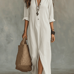 Woman wearing a black button-front bohemian shirt maxi dress with a flowy silhouette