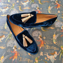 Midnight-blue velvet loafers with light champagne tassels