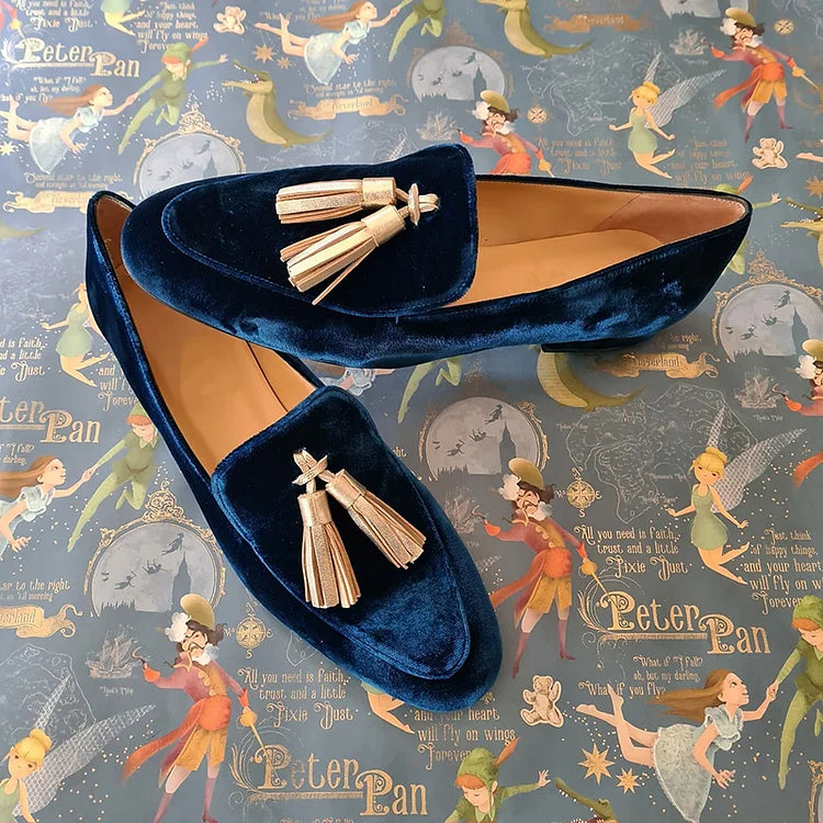 Midnight-blue velvet loafers with light champagne tassels